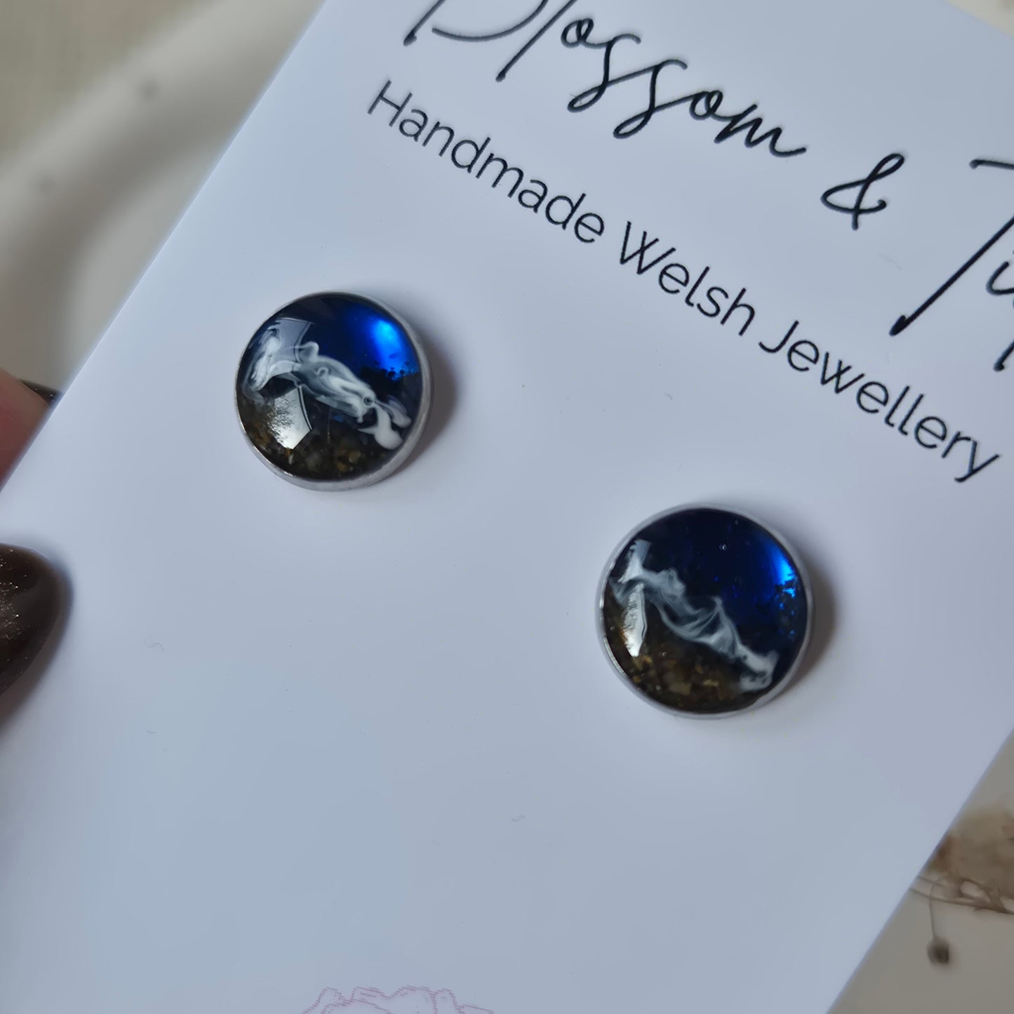 Pair of earrings on a 'Blossom & Tide' branded card