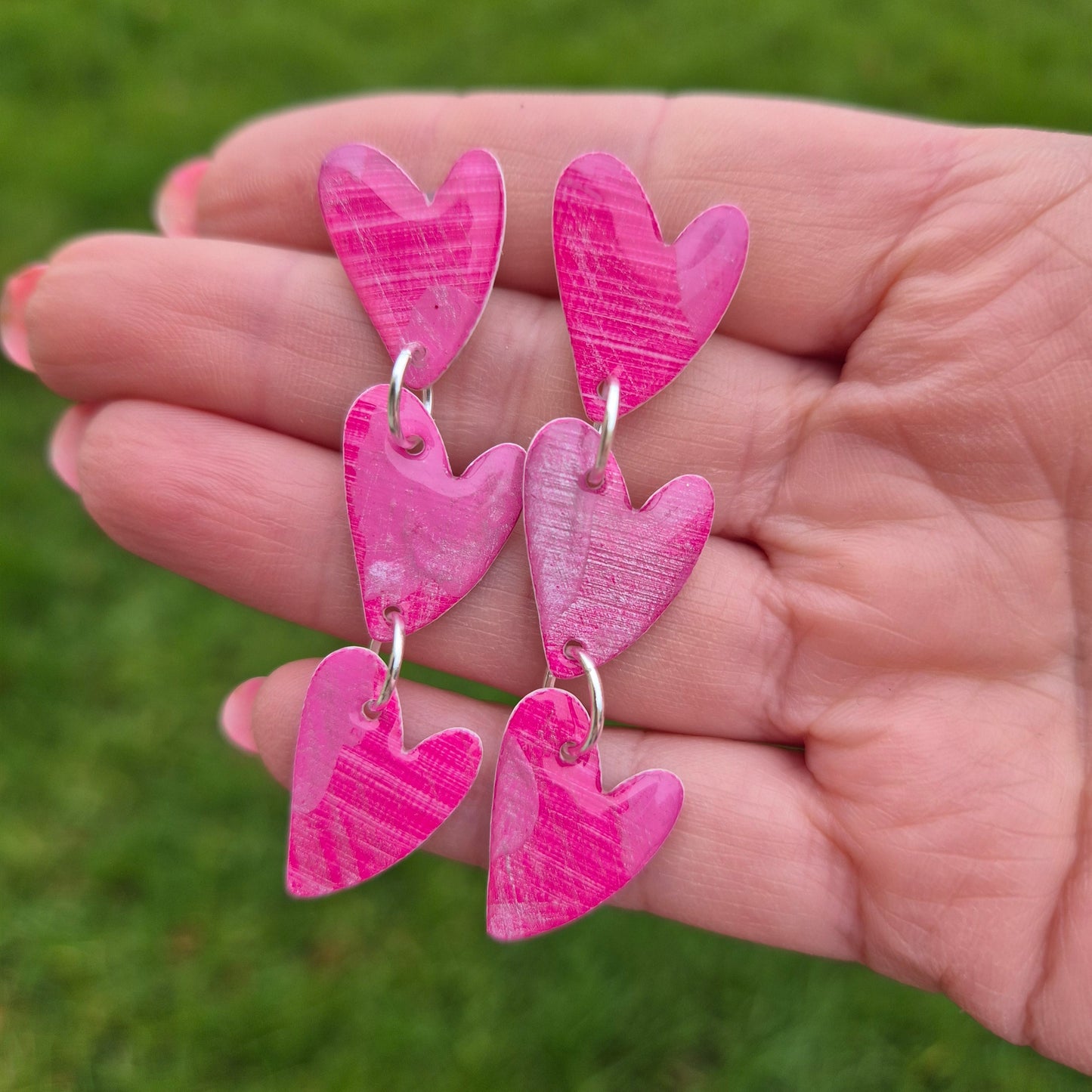 Hand painted art earrings with unique abstract patterns.