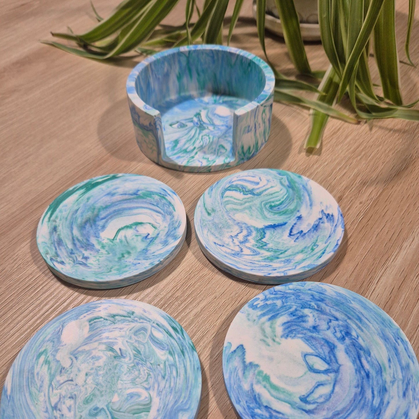 Set of 4 jesmonite coasters in matching holder. Blue and green.