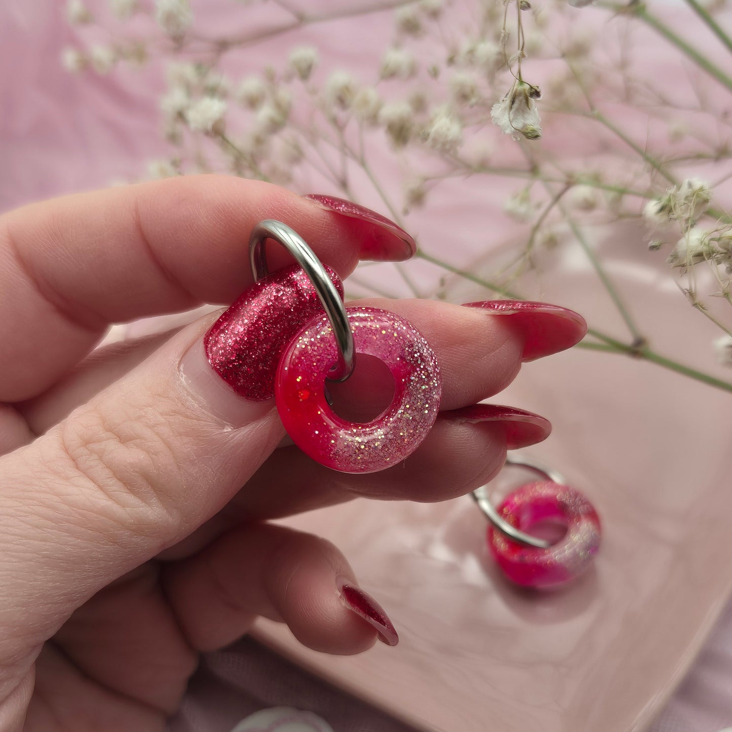 Romantic handcrafted donut hoop earrings presented on a branded card.