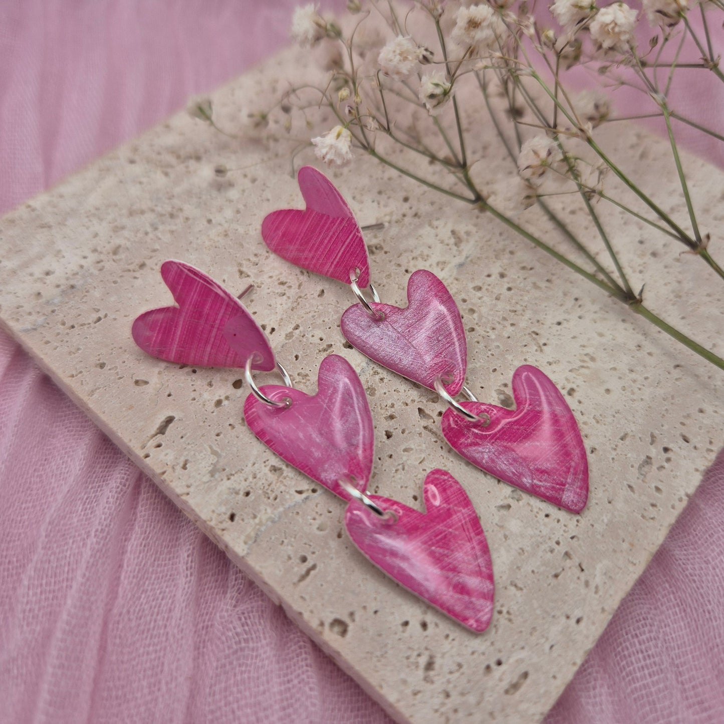 Hand painted art earrings with unique abstract patterns.