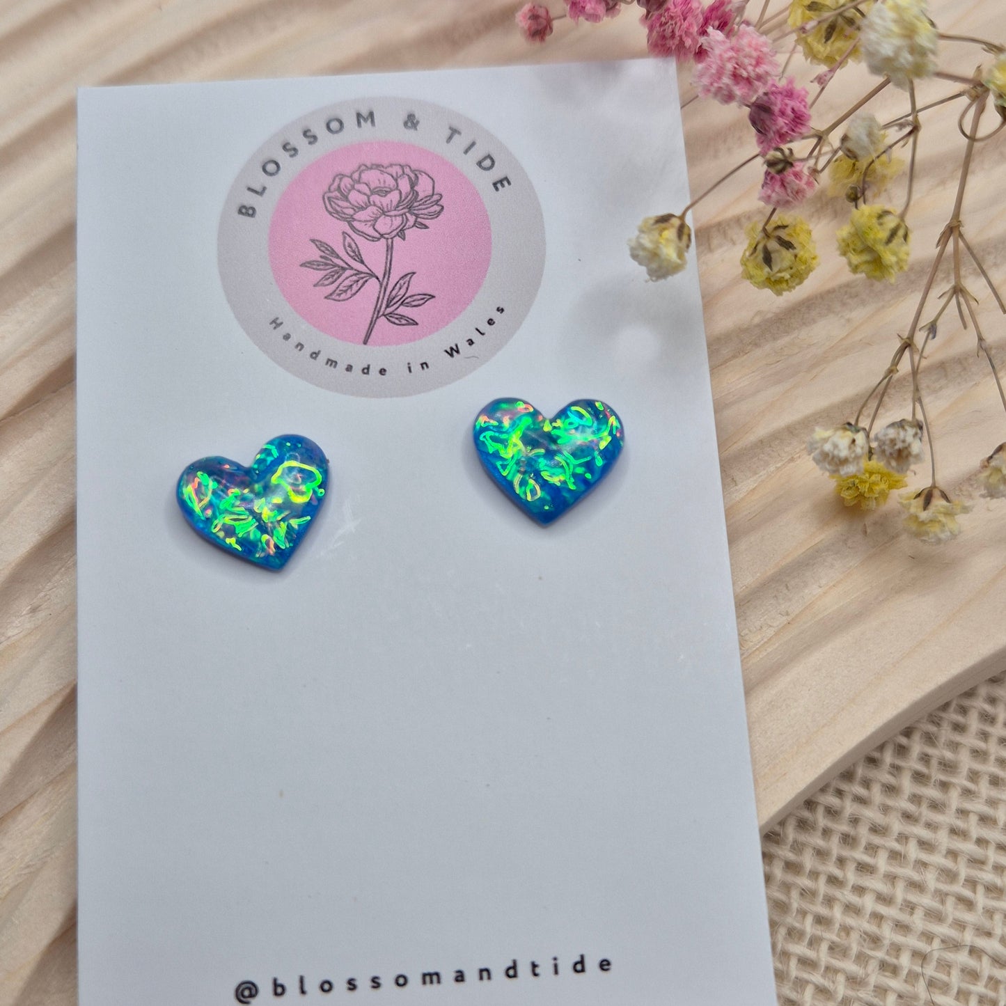Holographic resin earrings catching the light, ideal for romantic or everyday wear