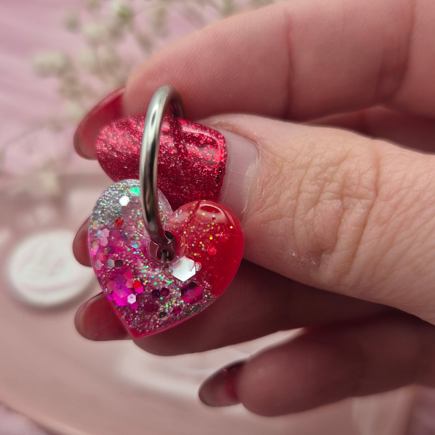 Romantic handcrafted heart hoop earrings presented on a branded card.