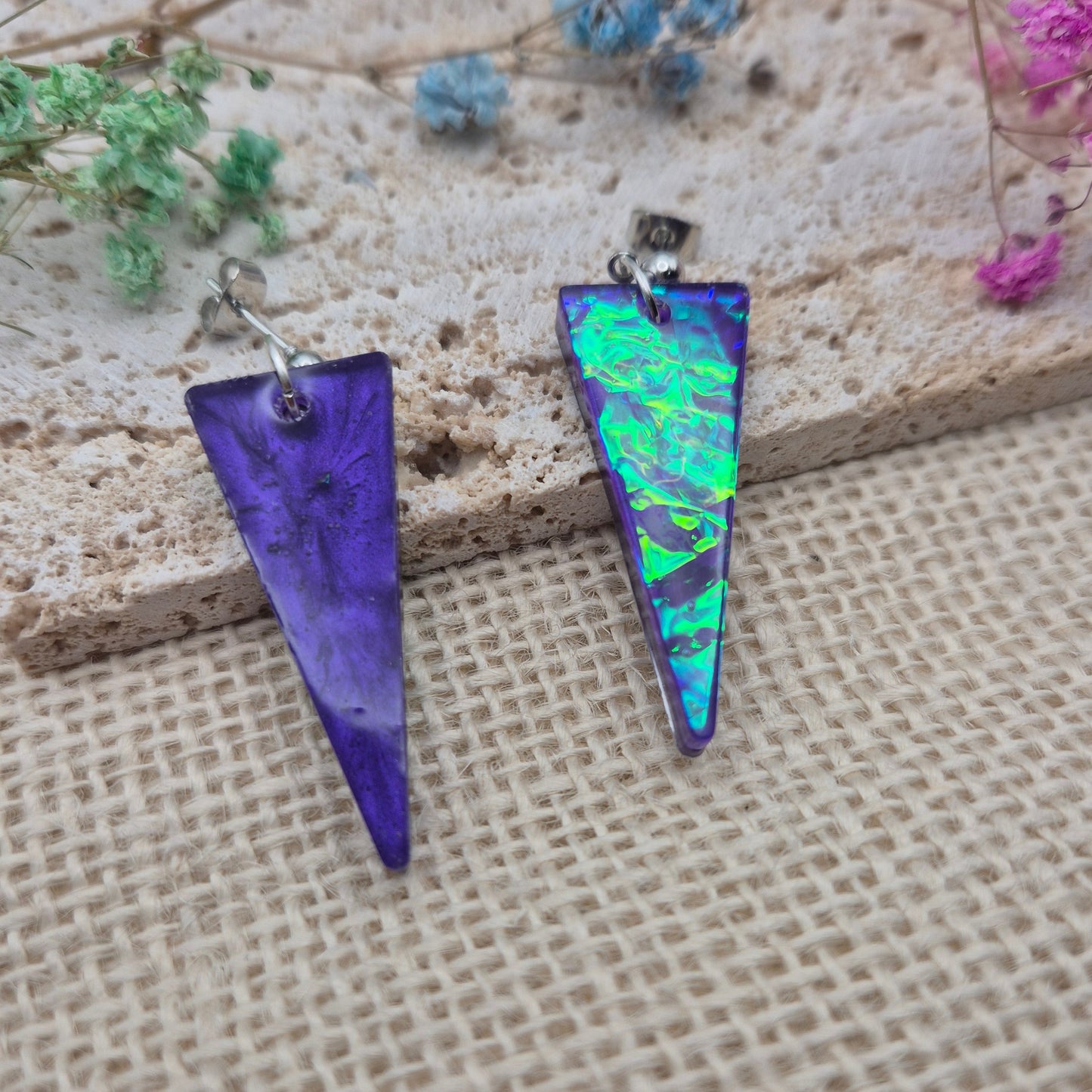 Triangle-shaped statement earrings reflecting colourful light, handmade in Wales