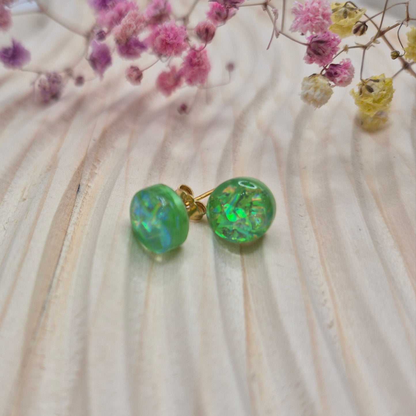Close-up of iridescent resin earrings, unique handmade jewellery