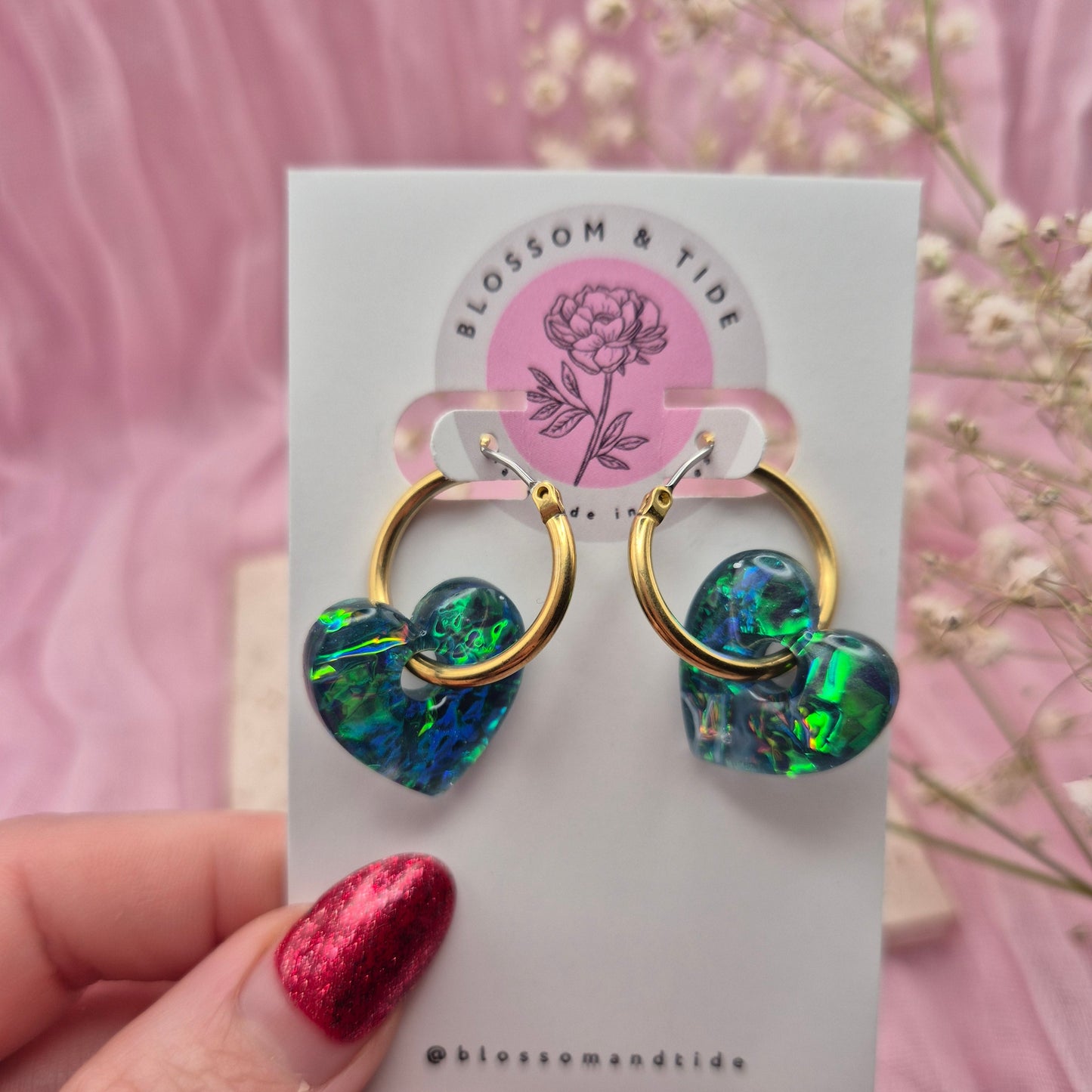 Valentine’s Day earrings featuring pink hearts and modern hoops.