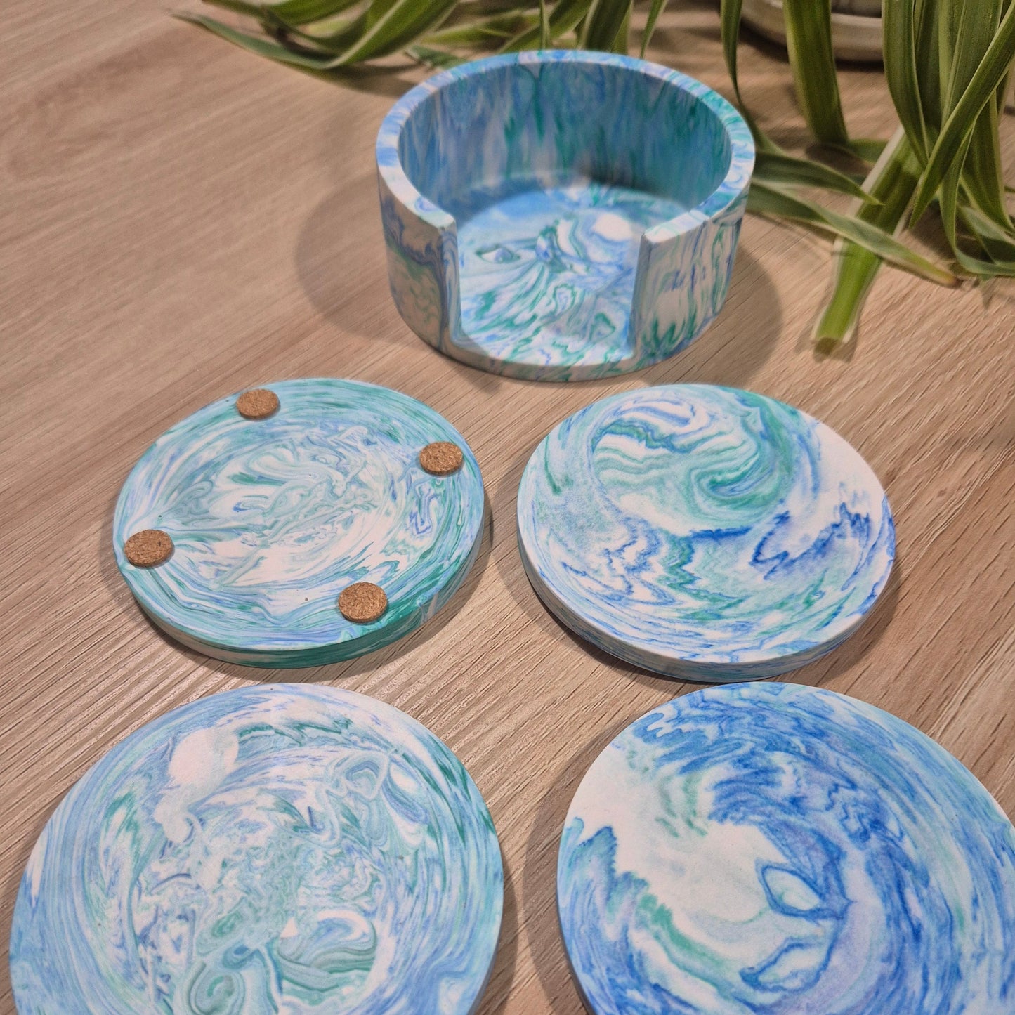 Jesmonite coaster set. had poured to create a unique effect. cork pad base.