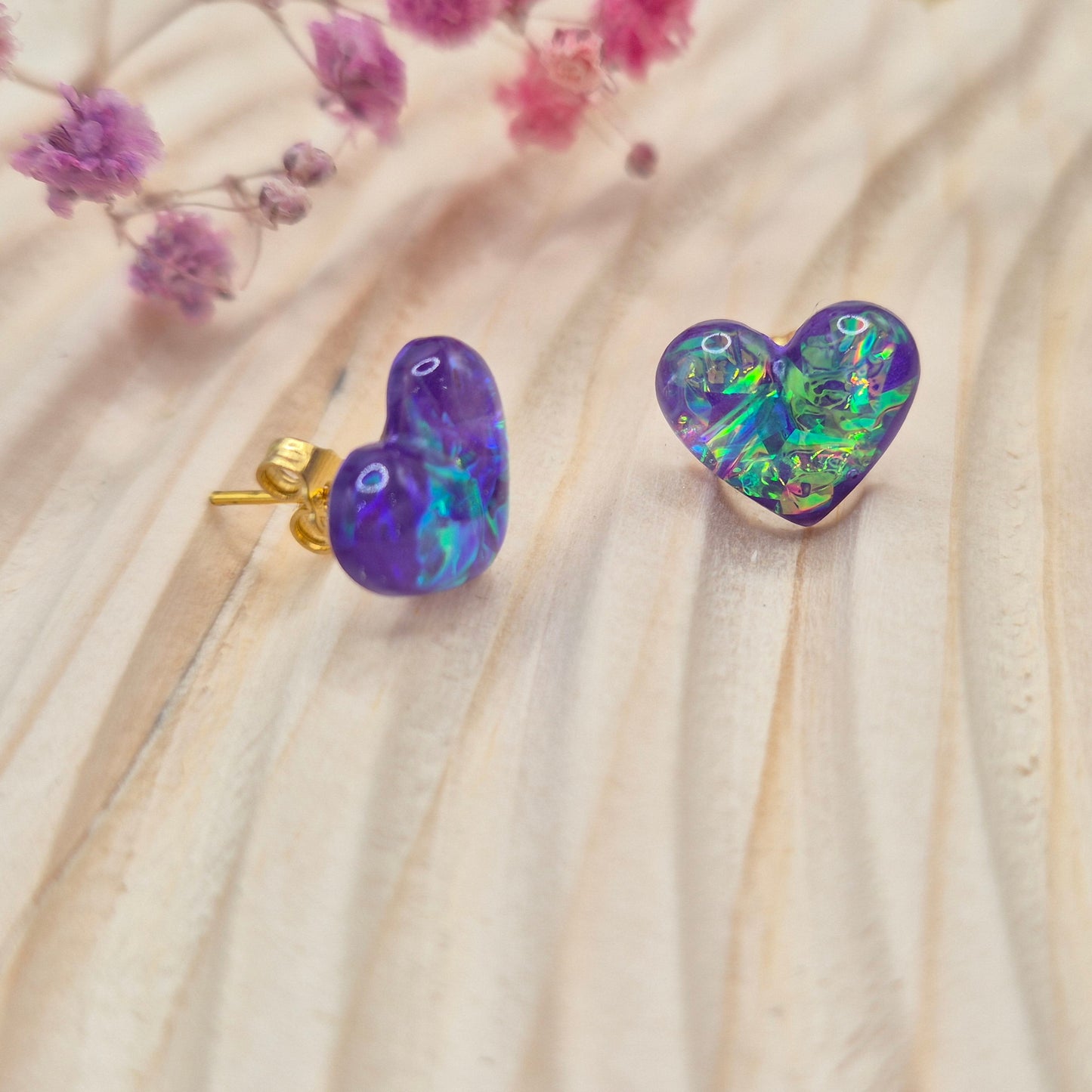 Heart-shaped stud earrings on branded display card, presented in an organza gift bag