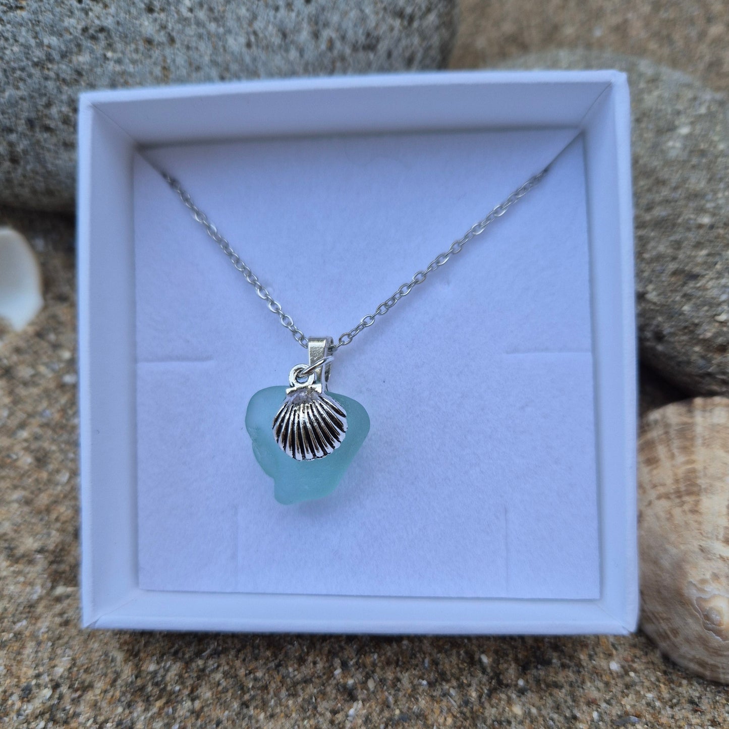 Sea glass necklace with shell charm in a gift box