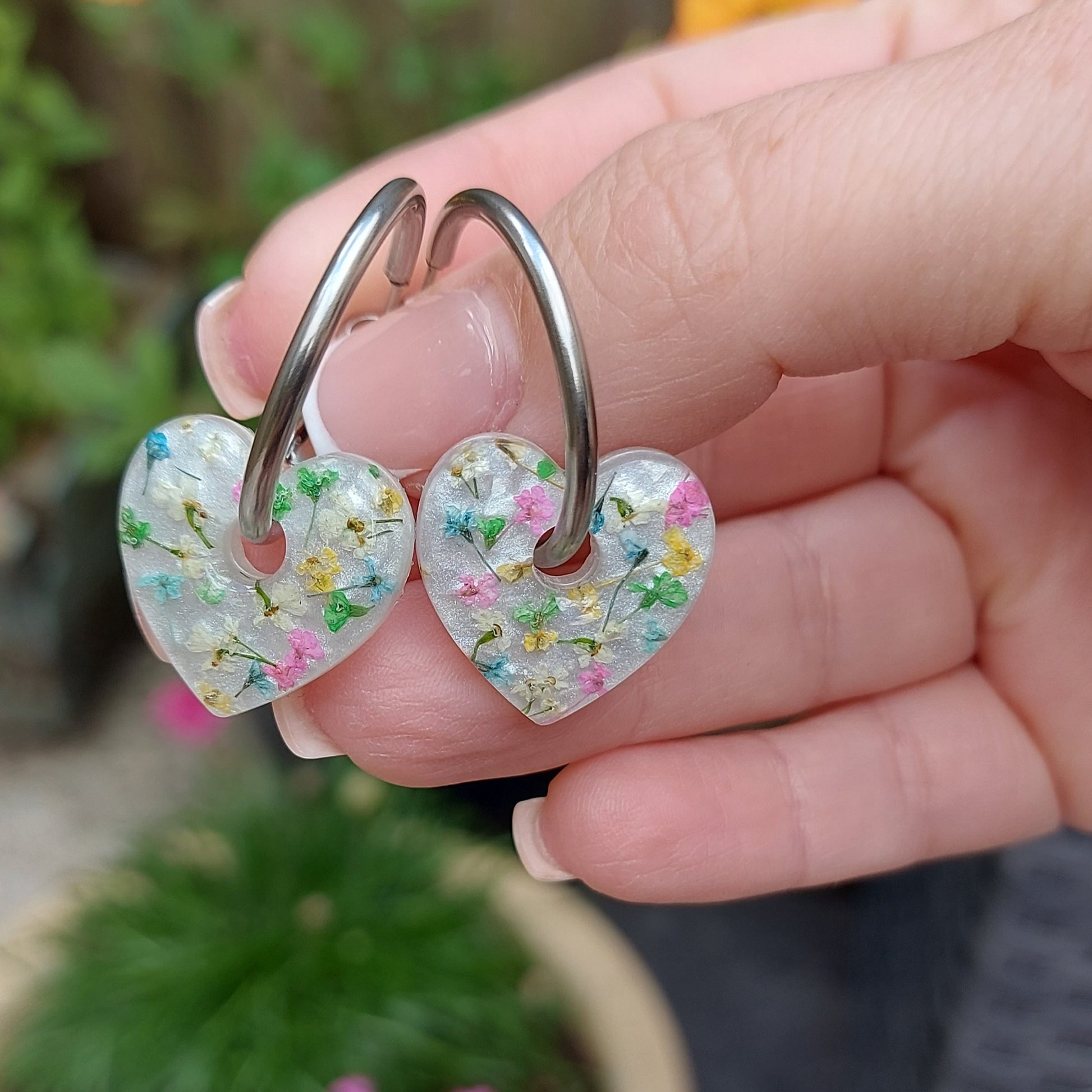 Artisan-crafted heart hoop earrings presented on a branded card.