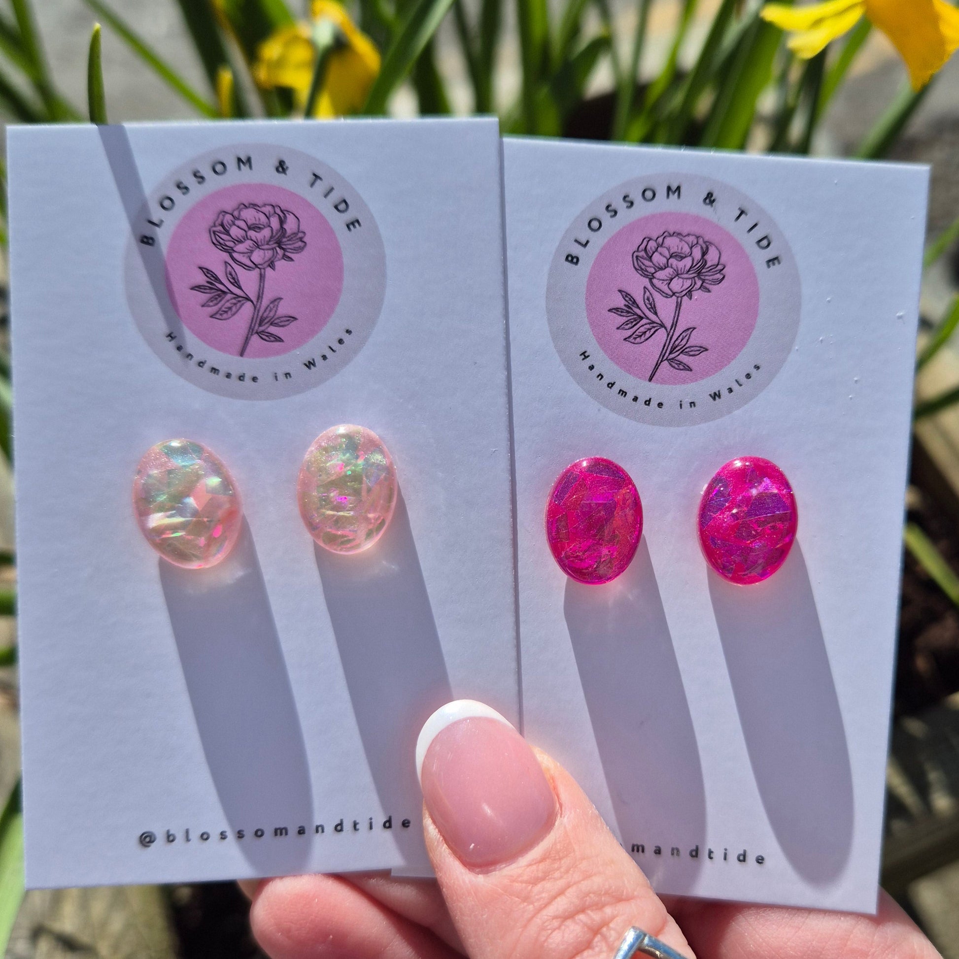  A pair of handmade pink oval stud earrings in hot pink and pale pink, with a shimmery finish, beautifully packaged in an organza bag and pip box.