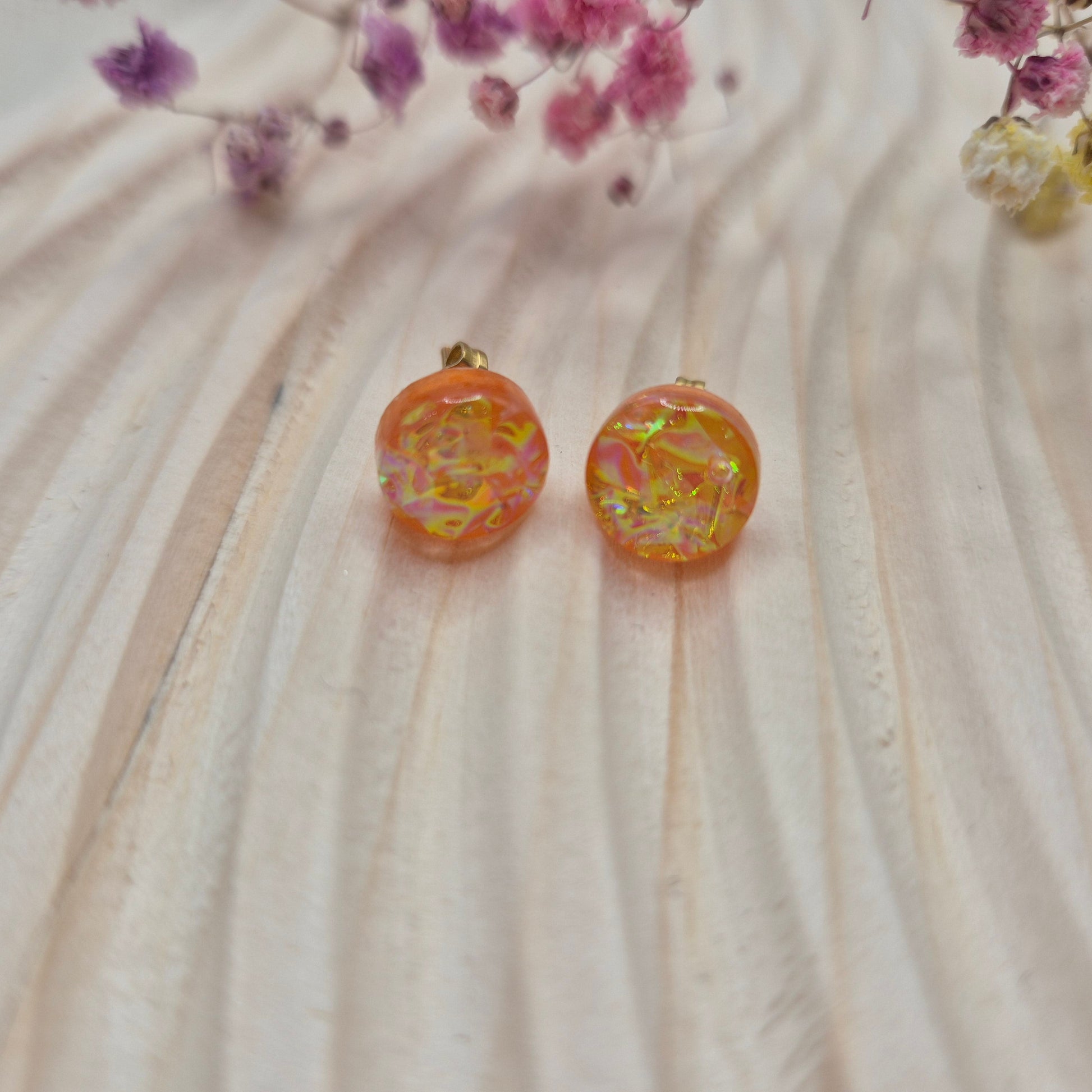 Close-up of iridescent resin earrings, unique handmade jewellery