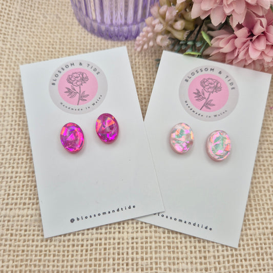  A pair of handmade pink oval stud earrings in hot pink and pale pink, with a shimmery finish, beautifully packaged in an organza bag and pip box.