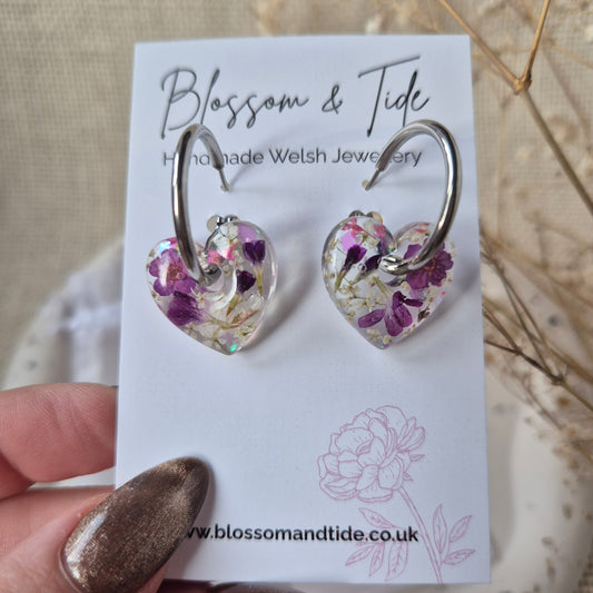 Floral earrings on a branded earring card 