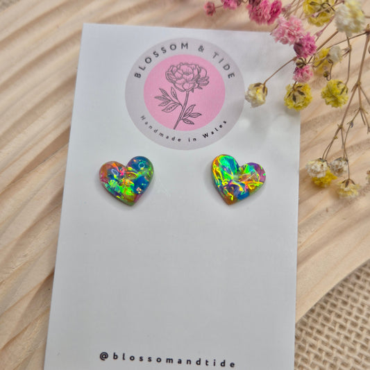 Heart-shaped stud earrings on branded display card, presented in an organza gift bag