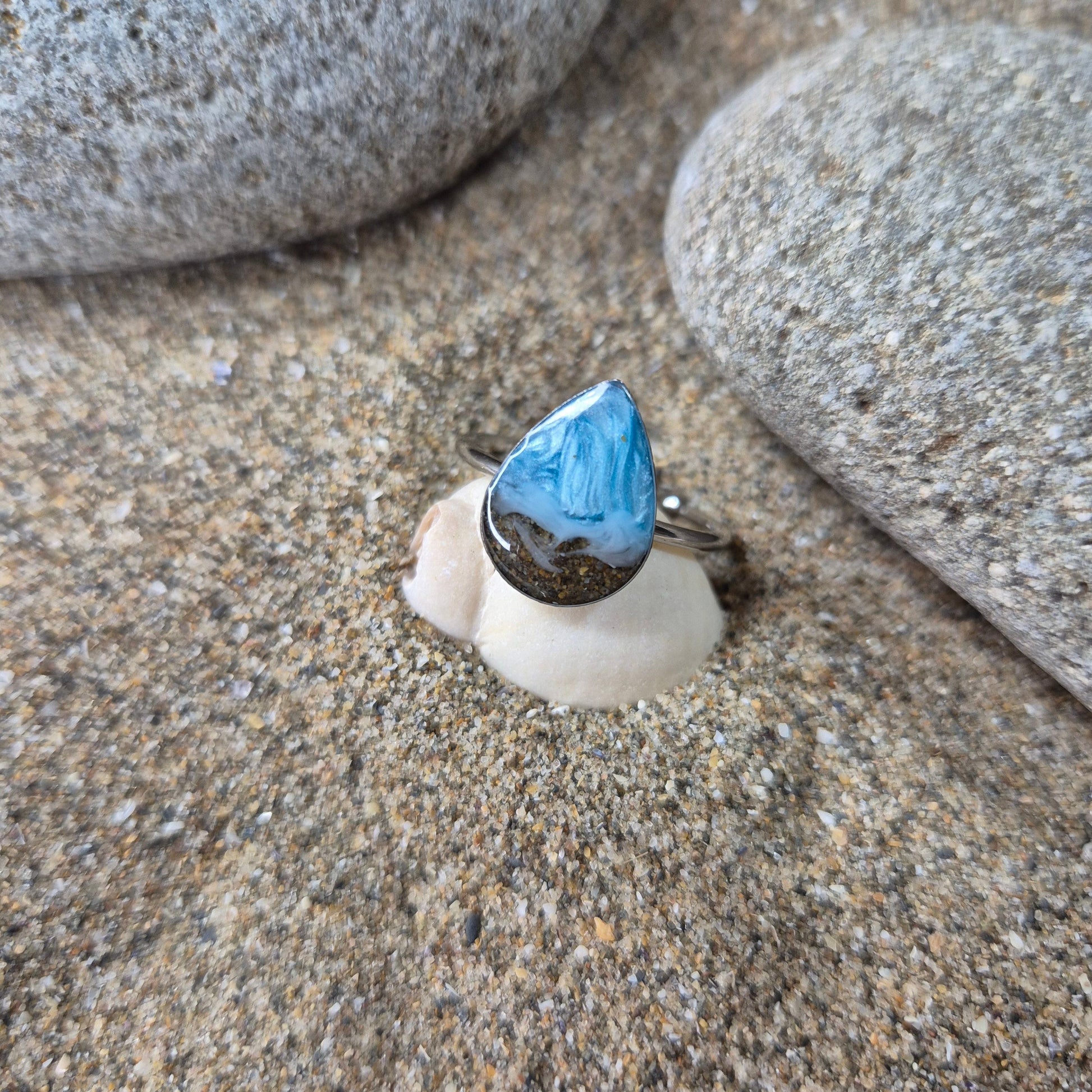 Teardrop shaped adjustable ring with Welsh beach sand.
