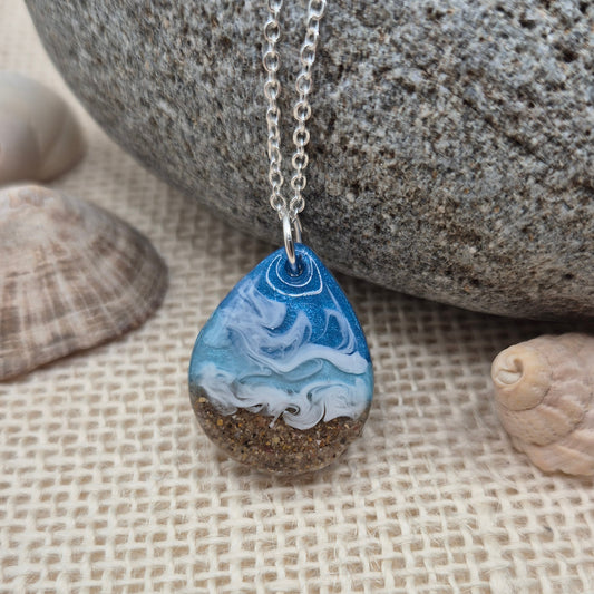Teardrop necklace filled with real Welsh beach sand and resin waves.