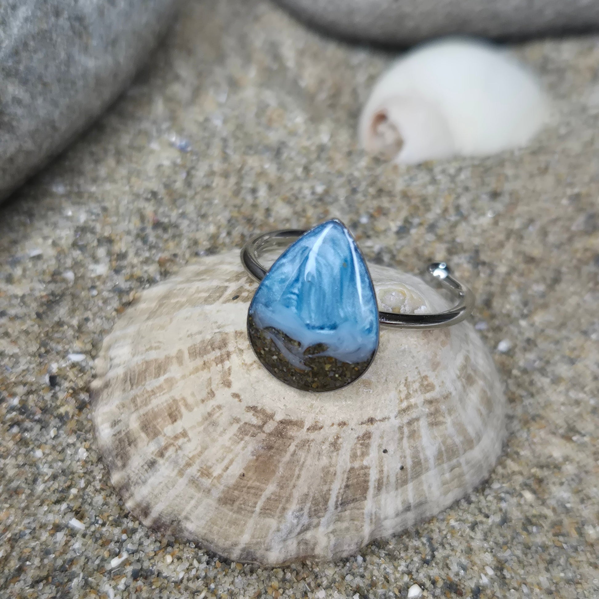 teardrop shaped adjustable ring with Welsh beach sand.