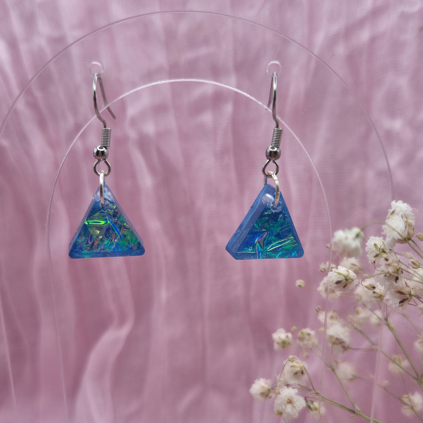 Modern geometric earrings with a shimmering holographic effect, ideal for special occasions or gifting.