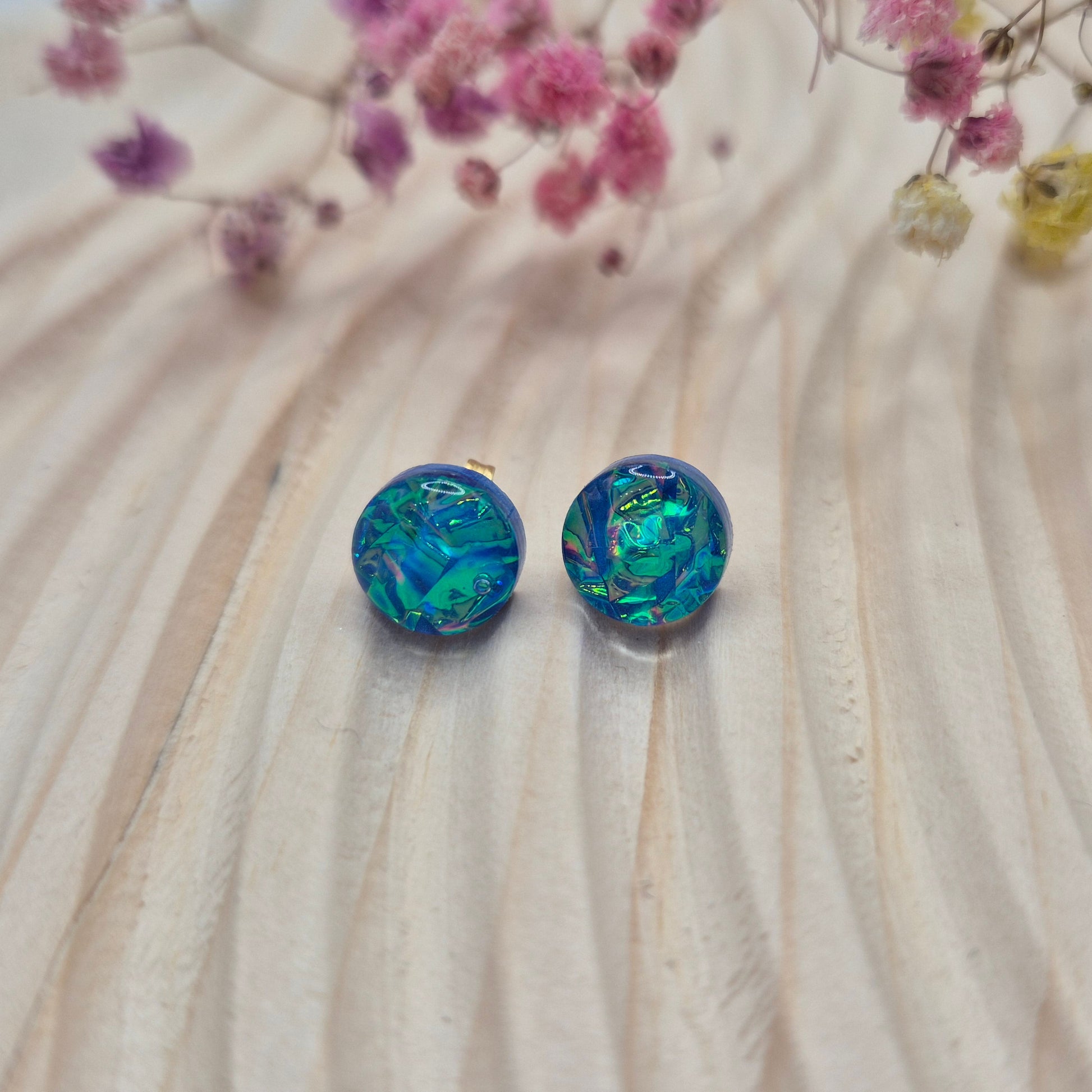 Close-up of iridescent resin earrings, unique handmade jewellery