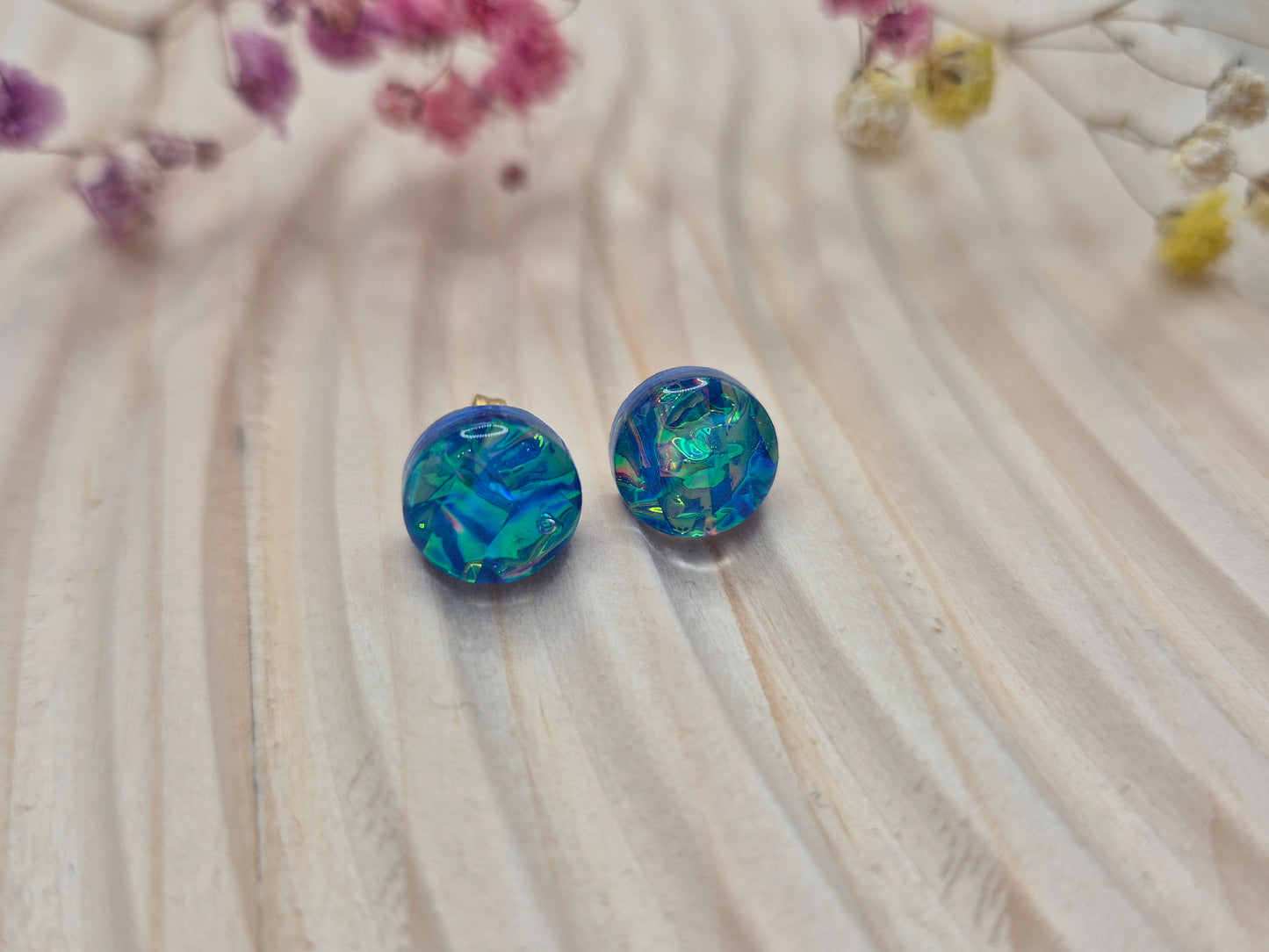 Close-up of iridescent resin earrings, unique handmade jewellery