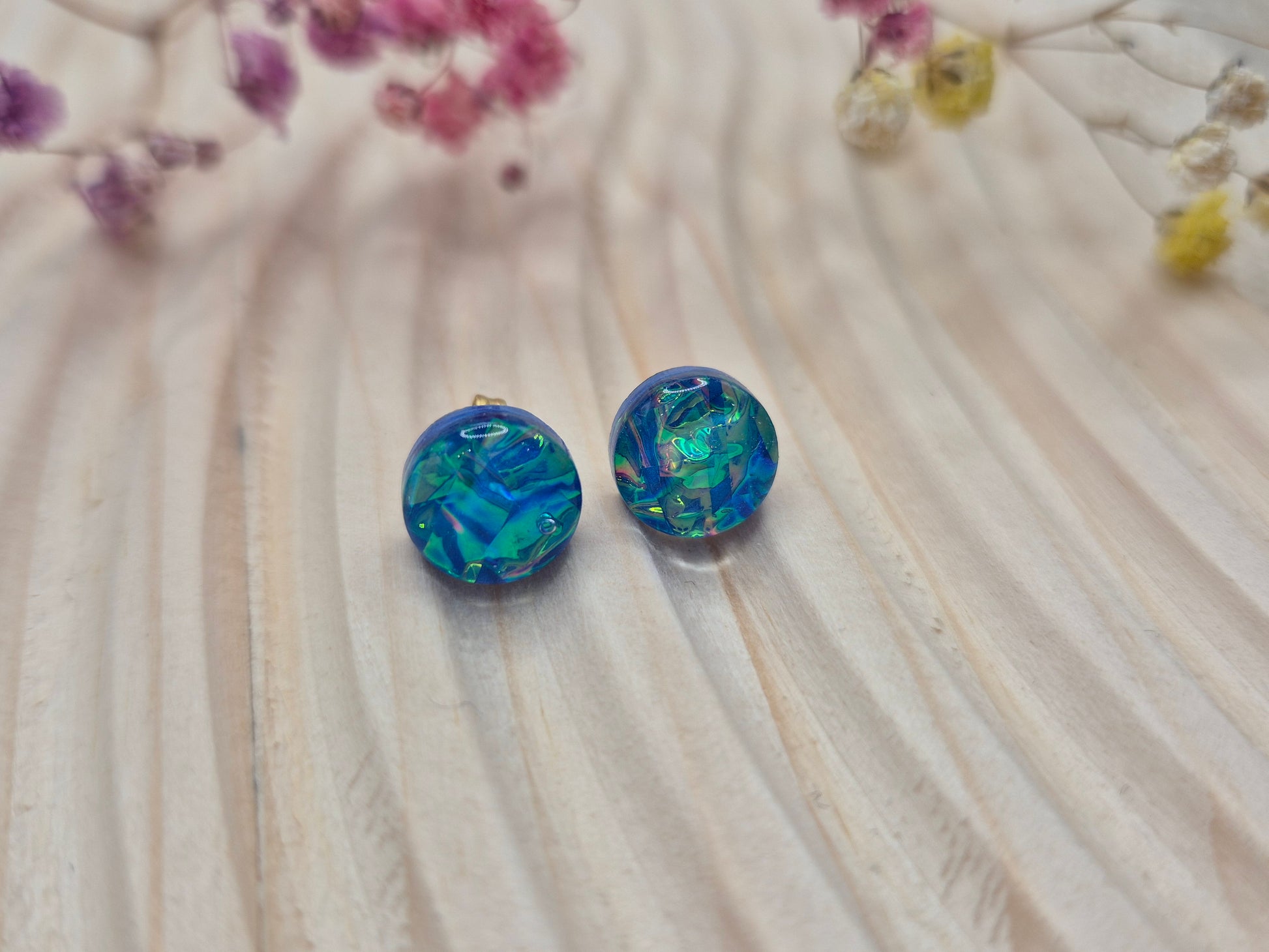 Close-up of iridescent resin earrings, unique handmade jewellery