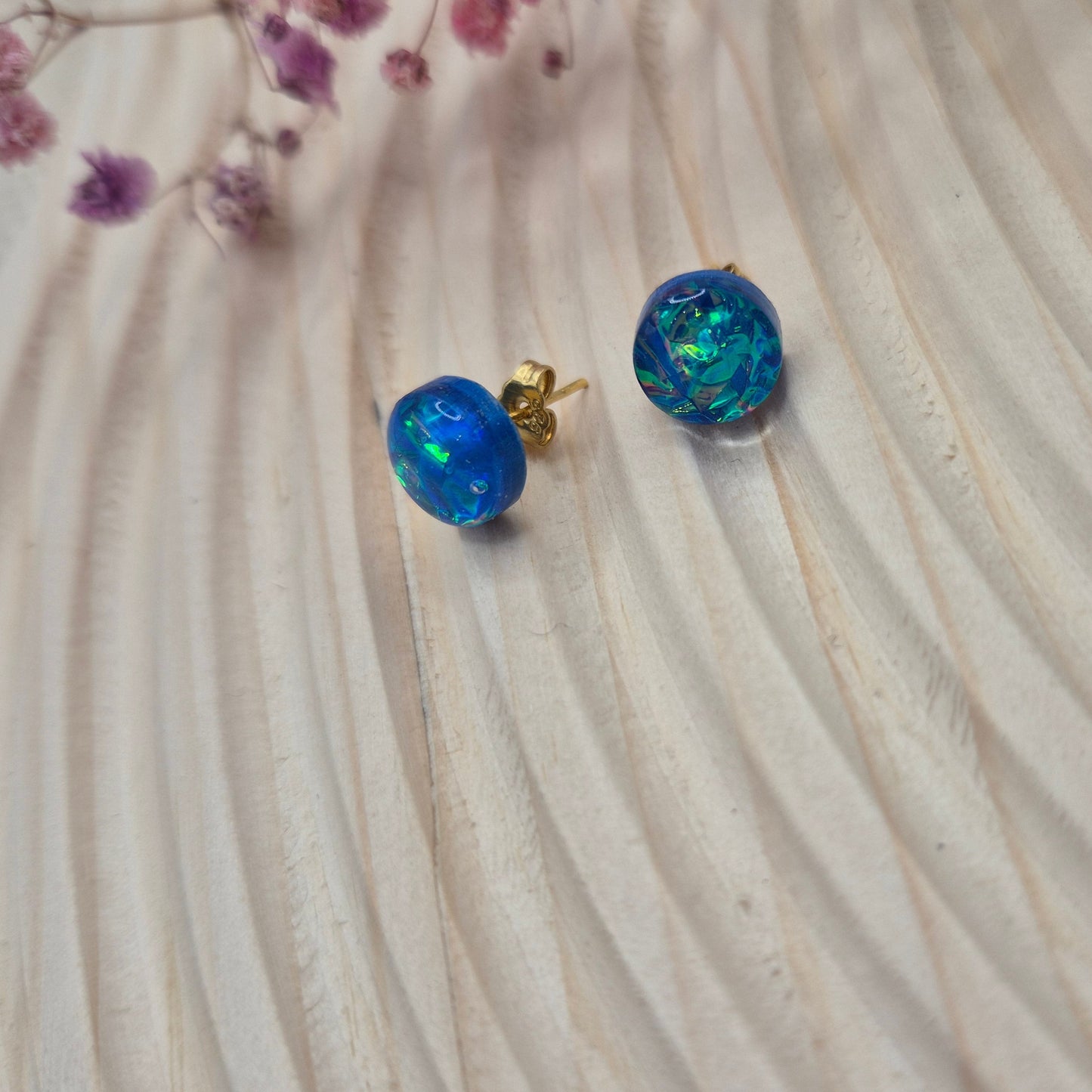 Close-up of iridescent resin earrings, unique handmade jewellery