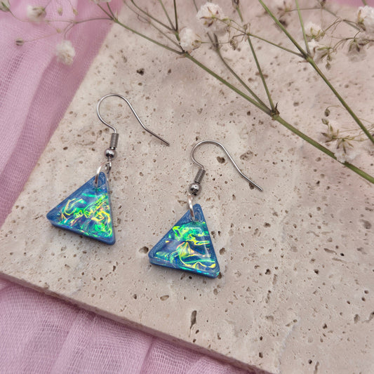Modern geometric earrings with a shimmering holographic effect, ideal for special occasions or gifting.