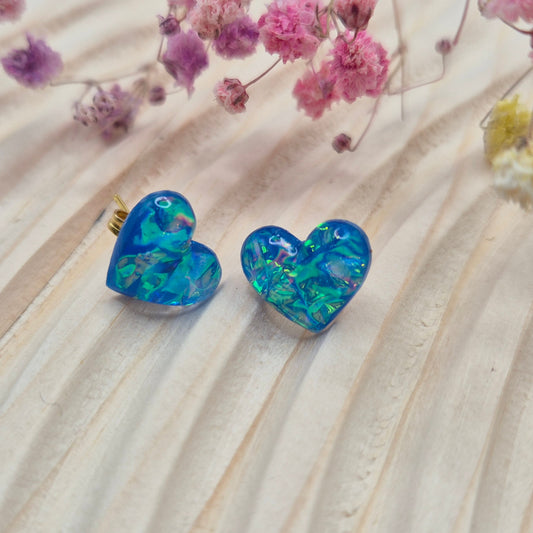 Holographic resin earrings catching the light, ideal for romantic or everyday wear