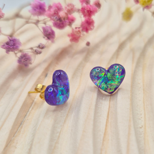 Heart-shaped stud earrings on branded display card, presented in an organza gift bag