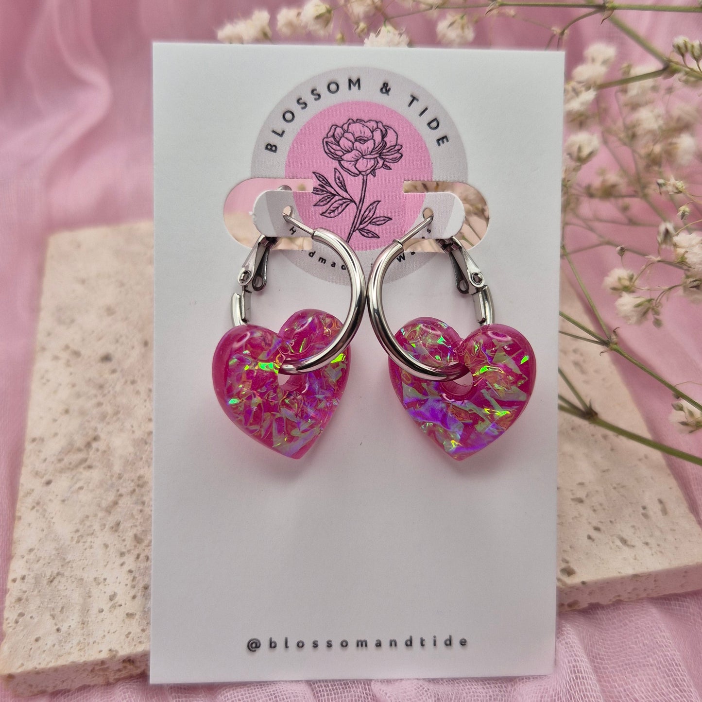 Valentine’s Day earrings featuring pink hearts and modern hoops.