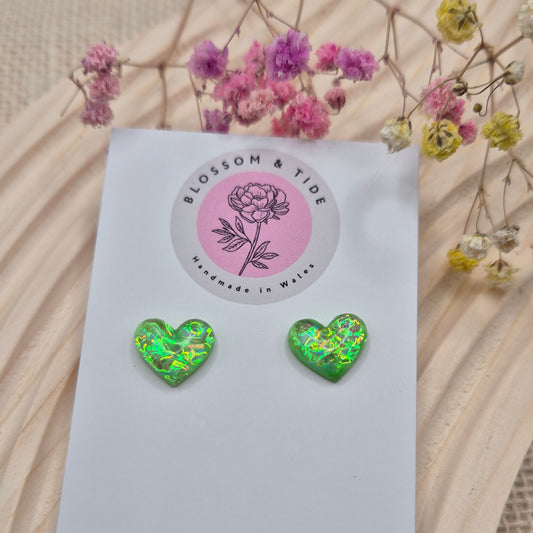 Holographic resin earrings catching the light, ideal for romantic or everyday wear
