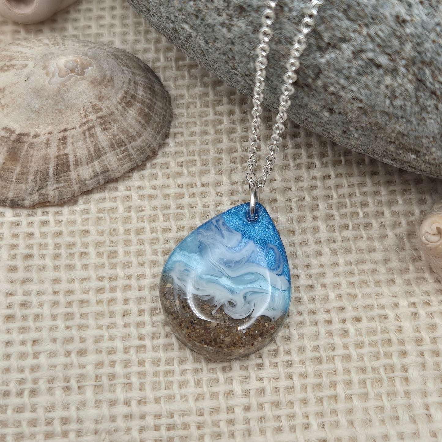 Teardrop necklace filled with real Welsh beach sand and resin waves.