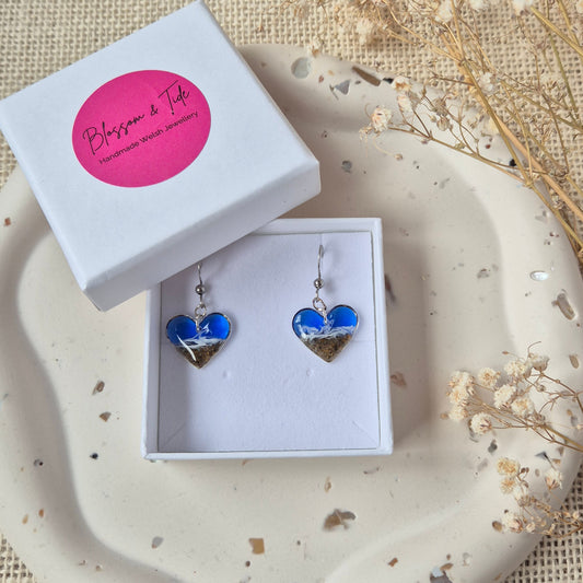 welsh beach sand heart shaped earrings in a branded "blossom & Tide" gift box, against a neutral background