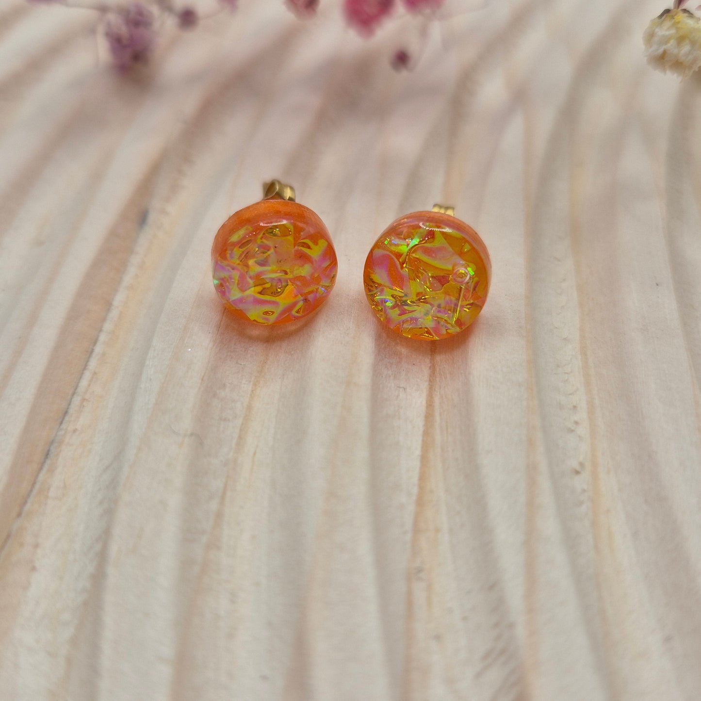 Close-up of iridescent resin earrings, unique handmade jewellery