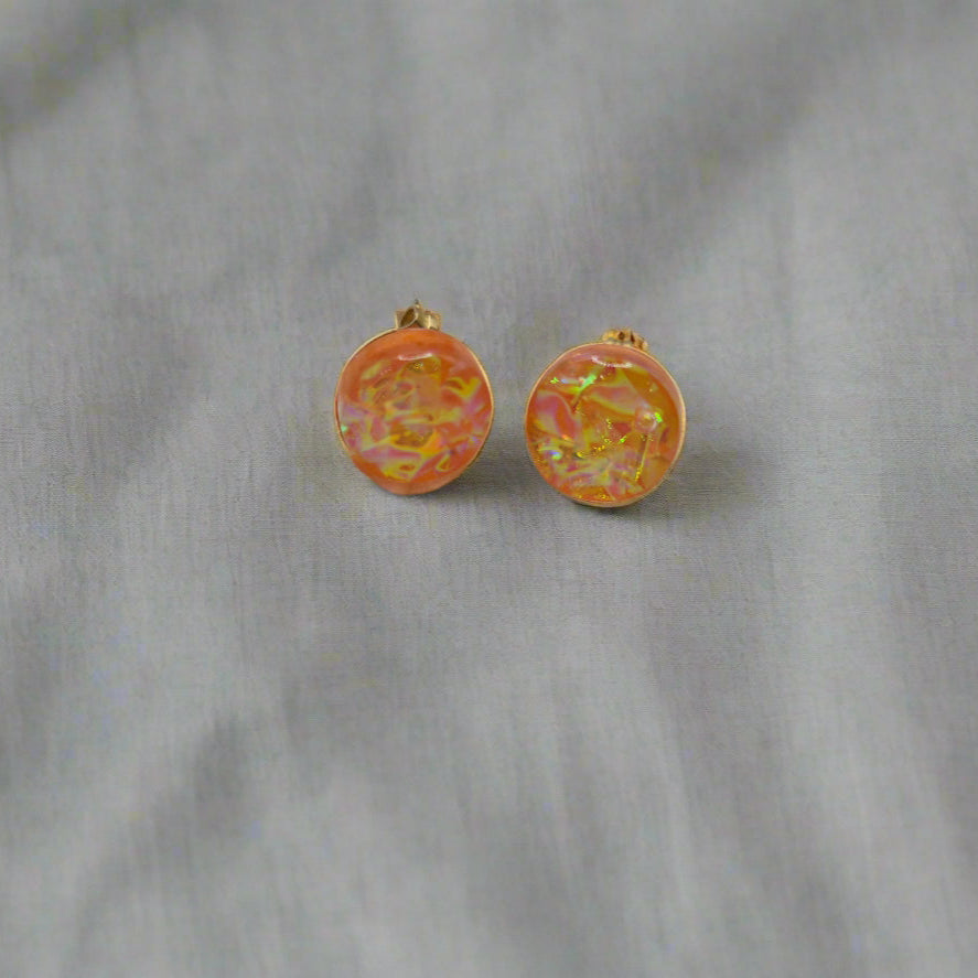 Close-up of iridescent resin earrings, unique handmade jewellery