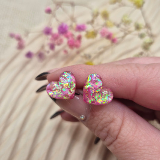 Holographic resin earrings catching the light, ideal for romantic or everyday wear
