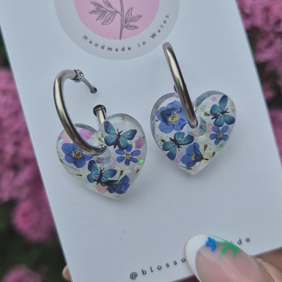 video of forget-me-not and blue butterfly hoop earrings