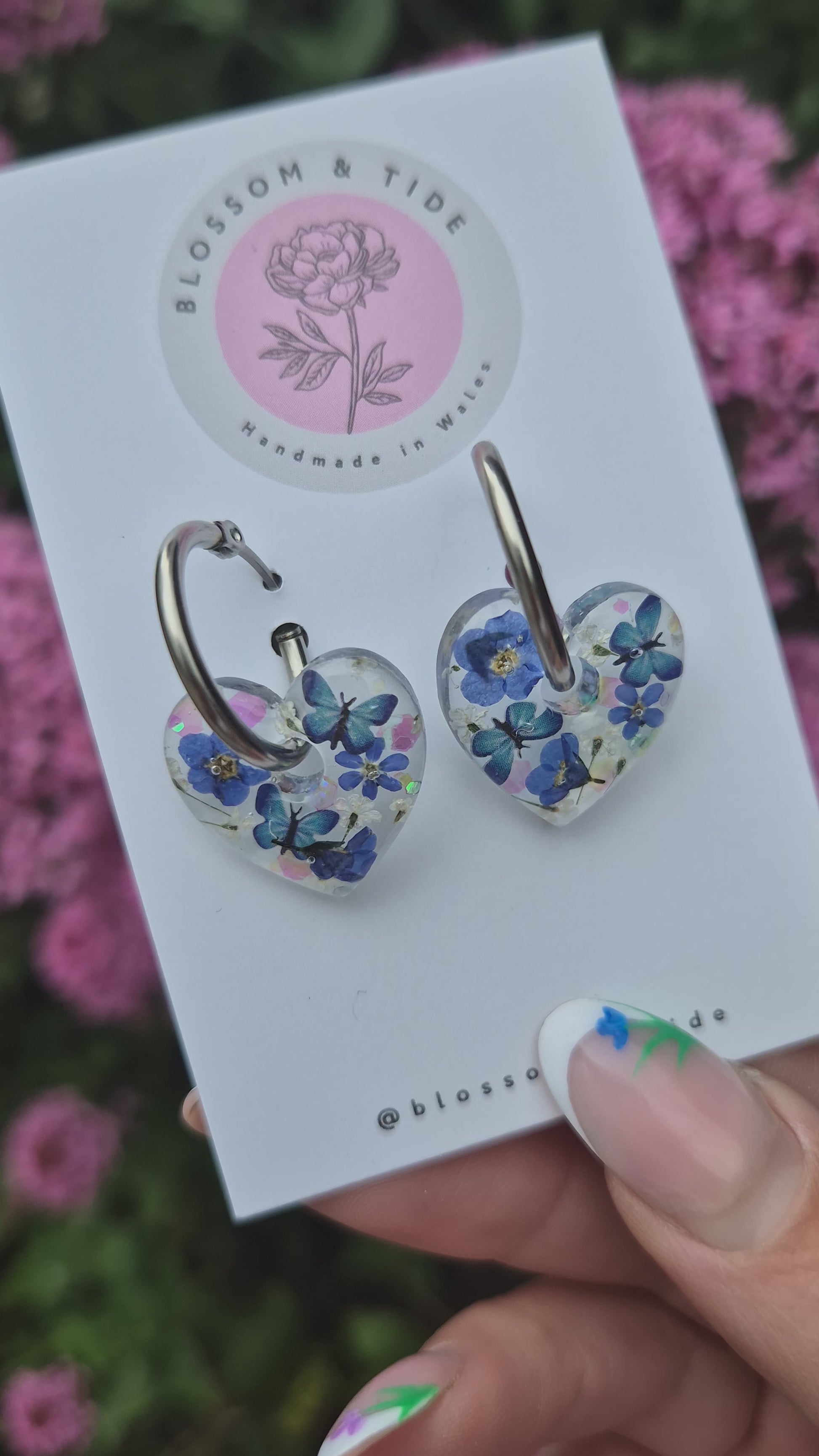 video of forget-me-not and blue butterfly hoop earrings