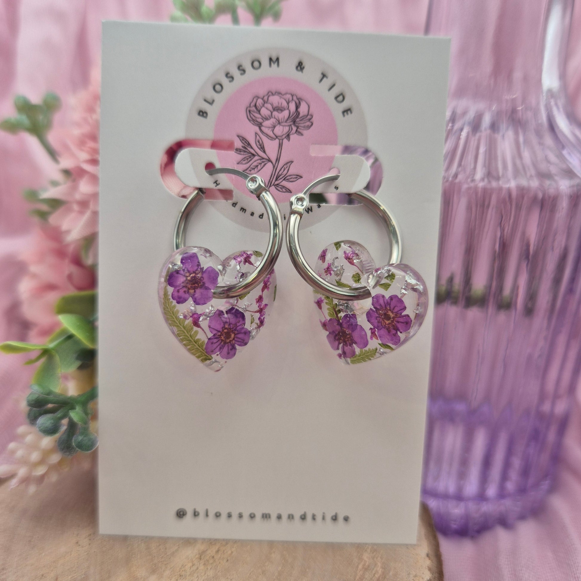 handmade purple flower hearts on silver stainless steel hoops