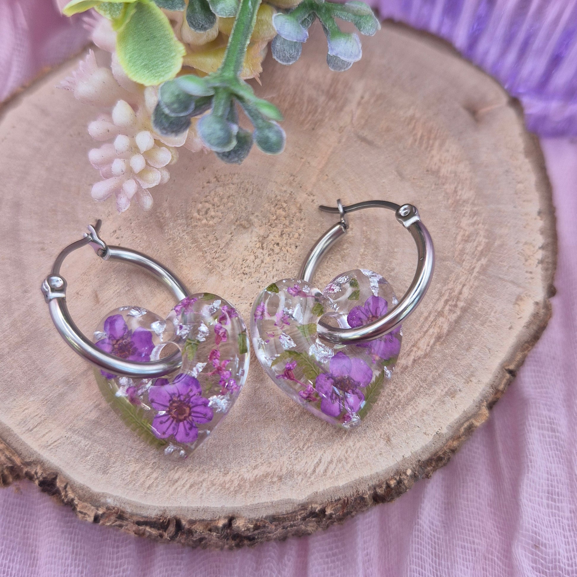 handmade purple flower hearts on silver stainless steel hoops