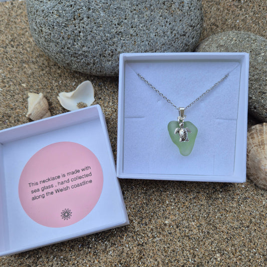 Sea glass necklace with shell charm in a gift box