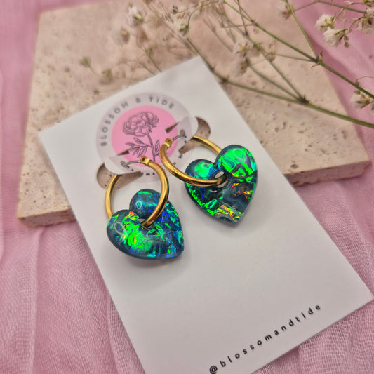 Valentine’s Day earrings featuring pink hearts and modern hoops.